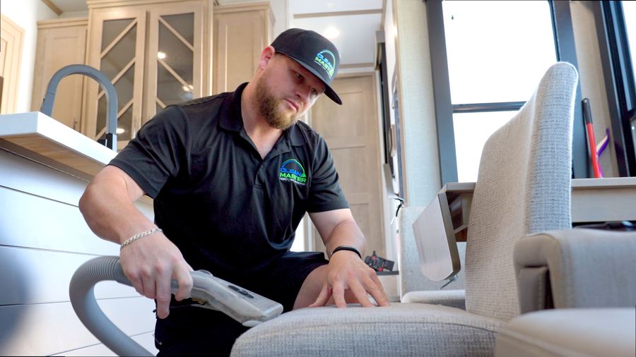 Clean Master technician cleaning upholstery